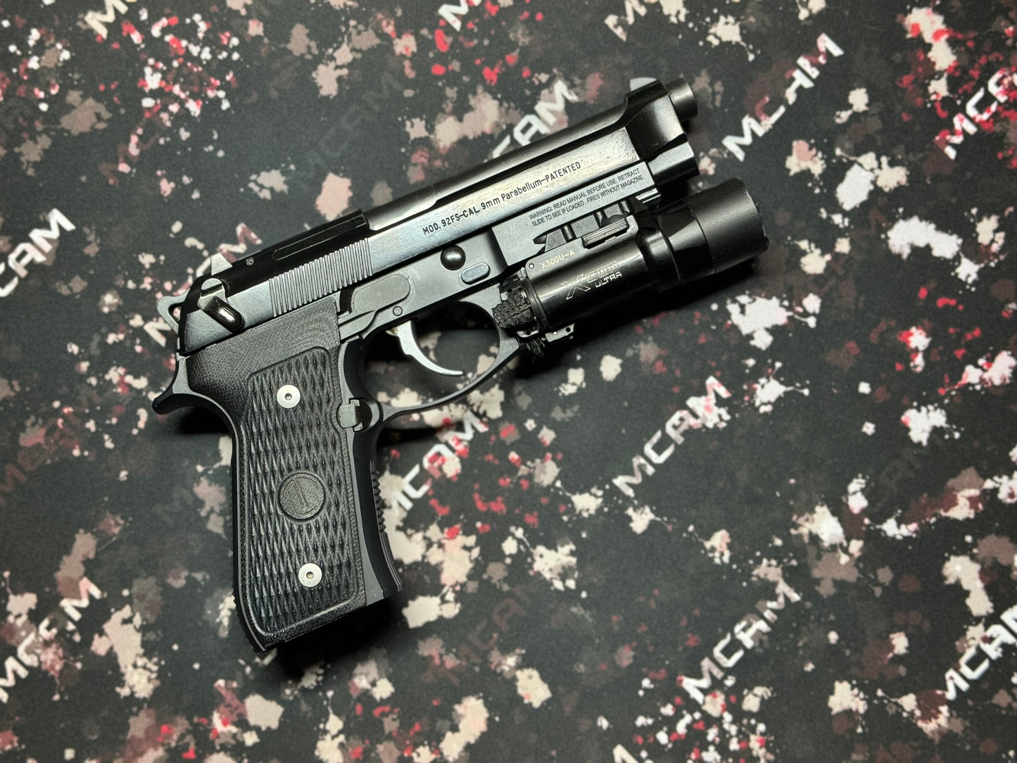 Military-themed 18x12 non-slip mat for weapon maintenance, showcasing a camouflage pattern, perfect for securely holding gun parts during cleaning. E-sports-ready 18x12 gaming mat, featuring a high-tech circuit board pattern, designed for precision mouse movement with a comfortable, anti-fray edge.