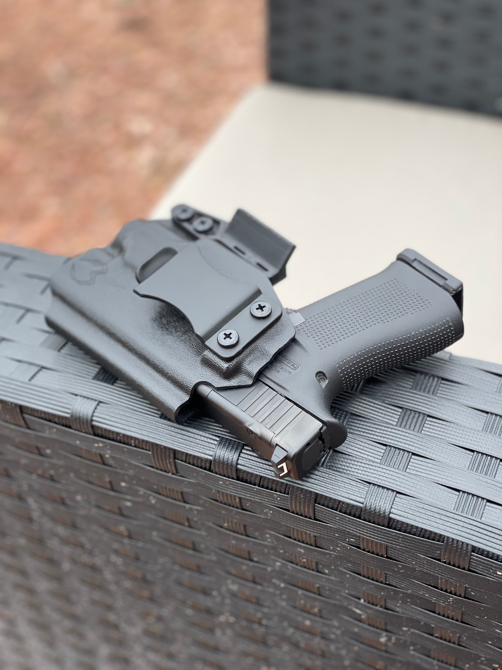 Custom-molded Kydex holster with RMR cut, compatible with popular reflex sights.